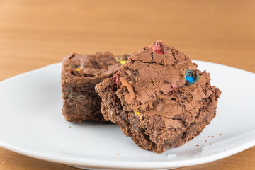 brownies in plate on wood table
