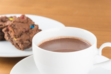 a cup of chocolate with brownie