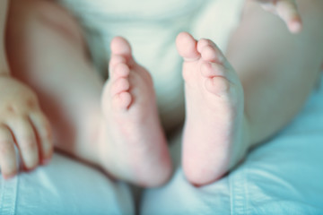 Baby hands and feet, closeup