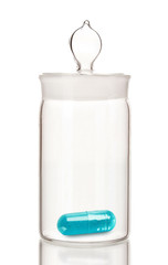 Transparent jar with pill isolated on white