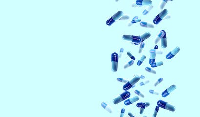 Falling medical pills on blue background