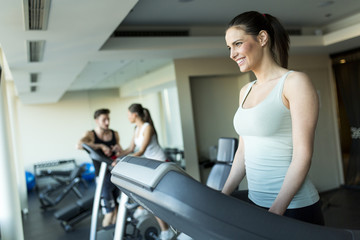 Fototapeta premium Young woman training in the gym