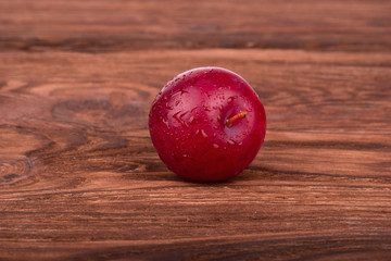 Red plum with drops