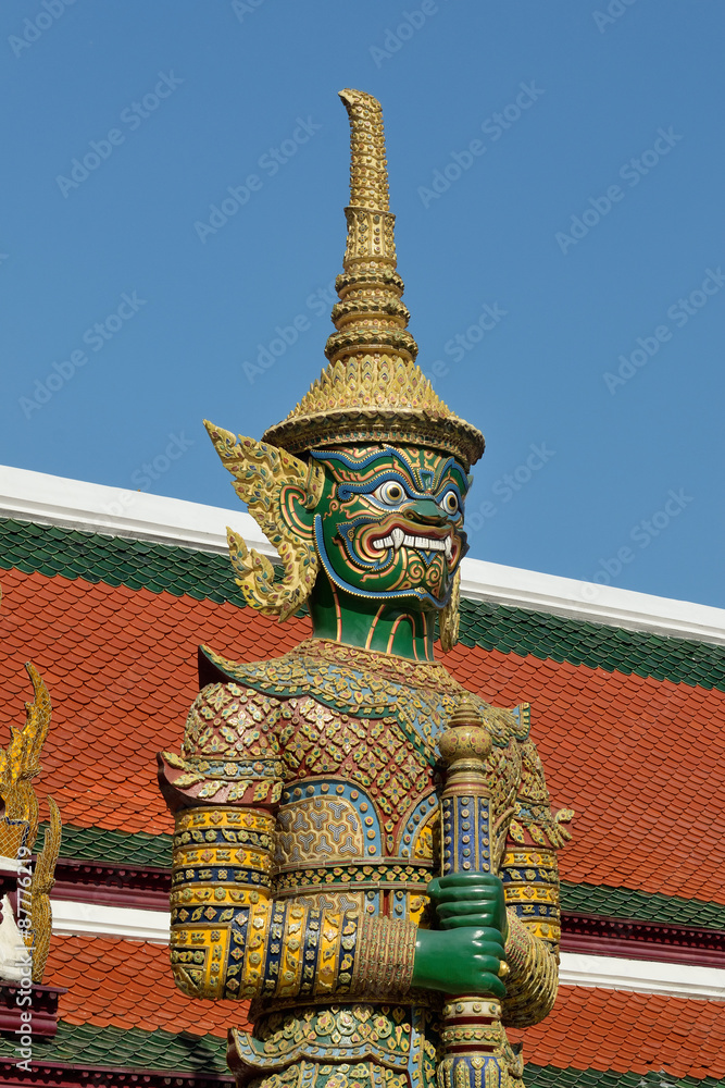 Wall mural the golden pagoda and yak statue at the phra kaew, bangkok,thailand