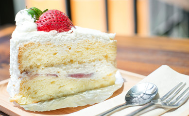 strawberry shortcake with spoon and fork, selective focus point