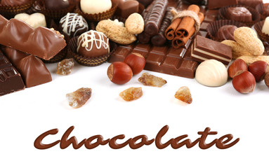 Delicious chocolate candies on white background