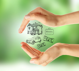 Female hands with drawings on nature background