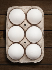 Eggs on wooden table.