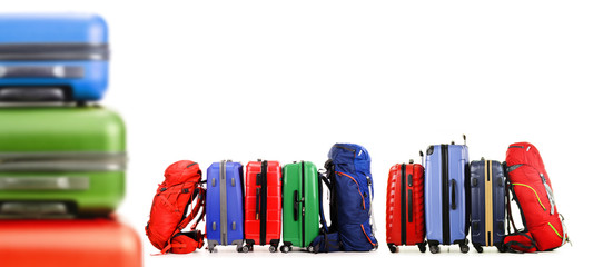 Suitcases and backpacks isolated on white background