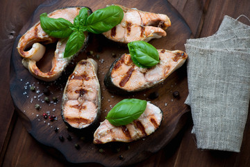 Grilled dog-salmon fillets with salt, pepper and basil, close-up