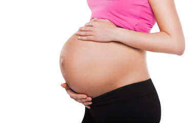 Pregnant belly of a woman - isolated over white background