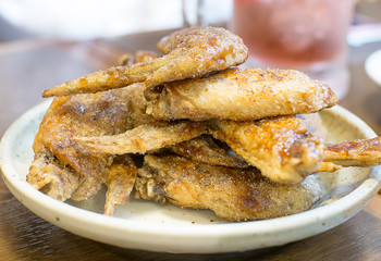 pepper fried chicken wing on white dish,selective focus point