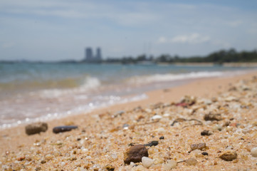 Fototapeta na wymiar stone and sand with blur sea background
