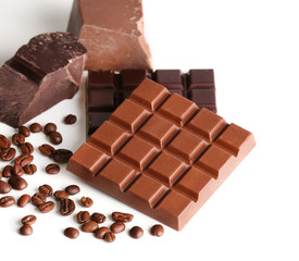 Milk and black chocolate bars with coffee beans isolated on white