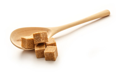 Cane sugar with wooden spoon