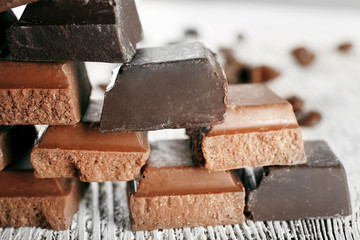 Pyramid of squared chocolate on wooden table