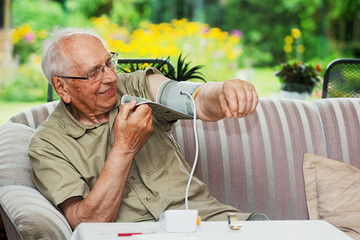 Elderly person with Sphygmomanometer