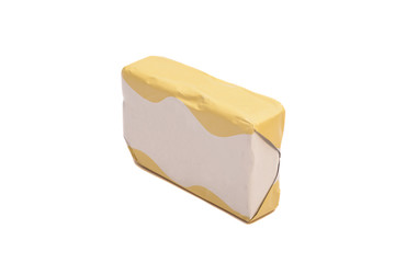 Stick of wrapped butter on white background