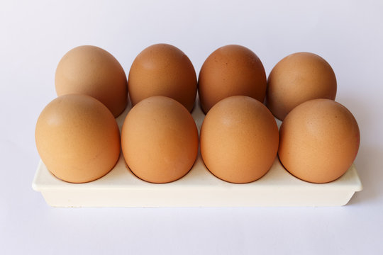 ten eggs on a pedestal white background
