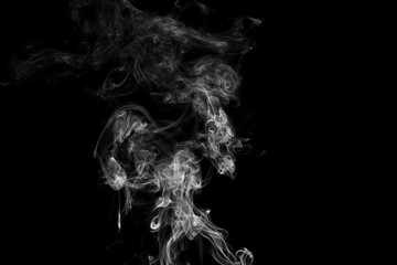 Obraz na płótnie Canvas Movement of white smoke on black background