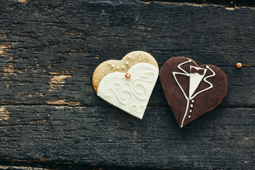 cookies decorated with wedding on wooden background - 87785211