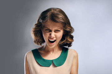 Portrait of beautiful model on gray background