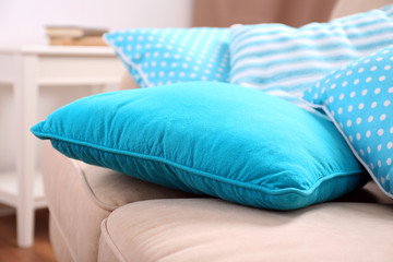 Fototapeta na wymiar Interior design with pillows on sofa, closeup