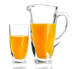 Glass and pitcher of orange juice isolated on white