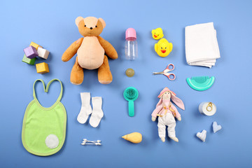 Baby collection on blue background, top view