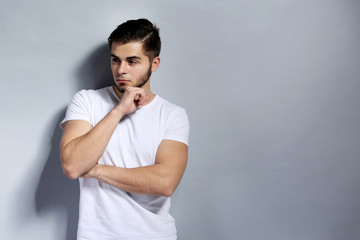 Young man on gray background