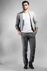Young man on gray background