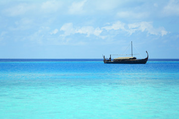 View of beautiful blue ocean water with ship in resort