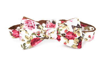 Bow tie with floral image on an isolated white background