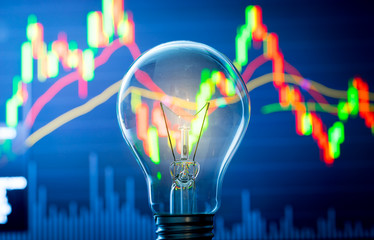 Business success with stock graph and light bulb - 87791285