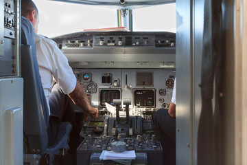 Plane cockpit with pilots after landing