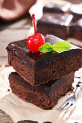 Delicious chocolate cakes on table close-up