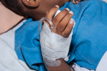  little boy Sick lying in a hospital IV.