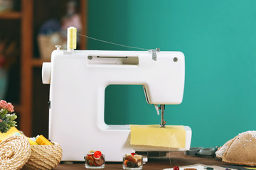 Sewing machine on table in workshop
