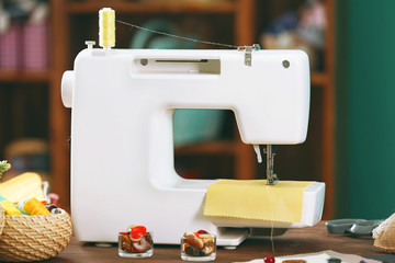 Sewing machine on table in workshop