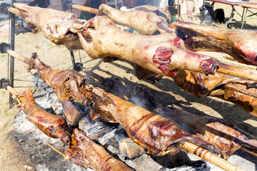 Lambs on spits roasting
