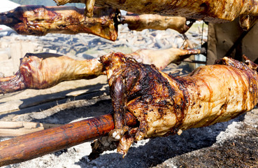 Lambs on spits roasting