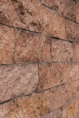 Angle of inclination of the red-brick walls.