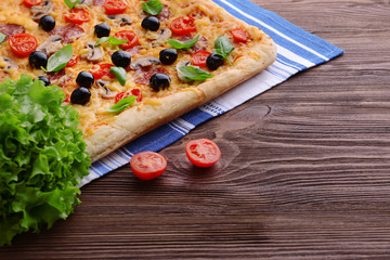 Delicious homemade pizza on table close-up