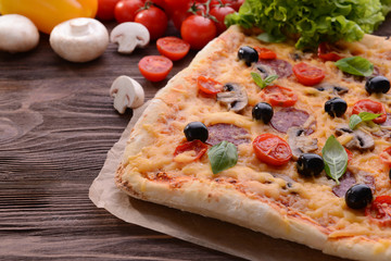Delicious homemade pizza on table close-up