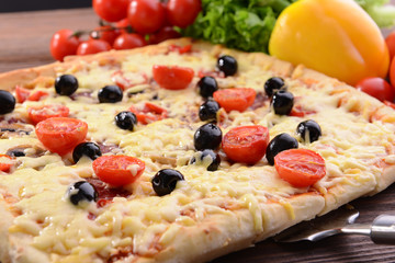 Delicious homemade pizza on table close-up