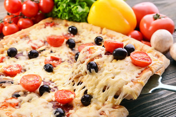 Delicious homemade pizza on table close-up