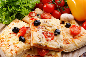 Delicious homemade pizza on table close-up