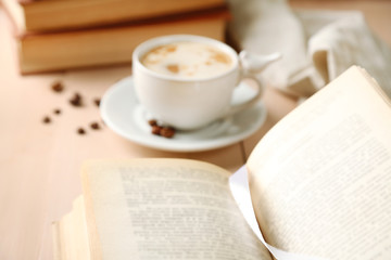 Still life with cup of coffee and books, close up