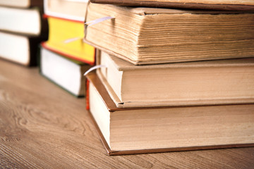 Stacks of books on table close up
