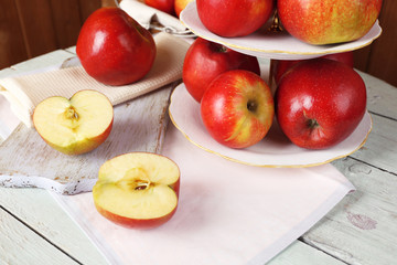 Tasty ripe apples on serving tray on table close up